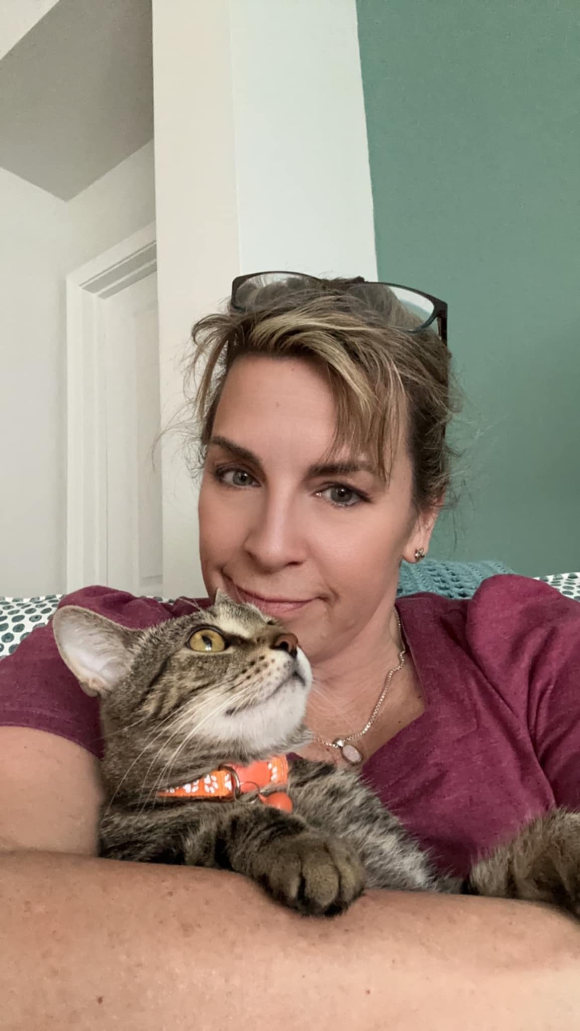 Mary cuddling a cat